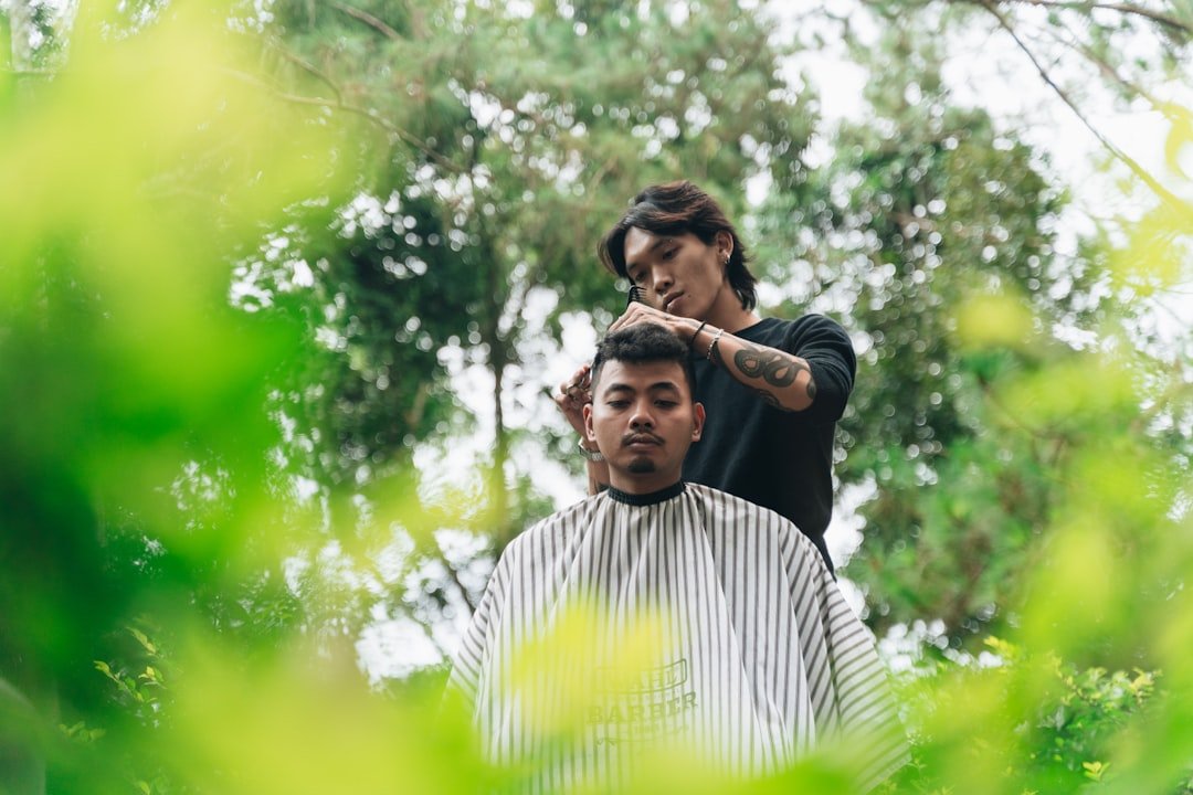 collection-05 barber-gives-a-haircut-outdoors-under-the-trees-86a2qwotnkk